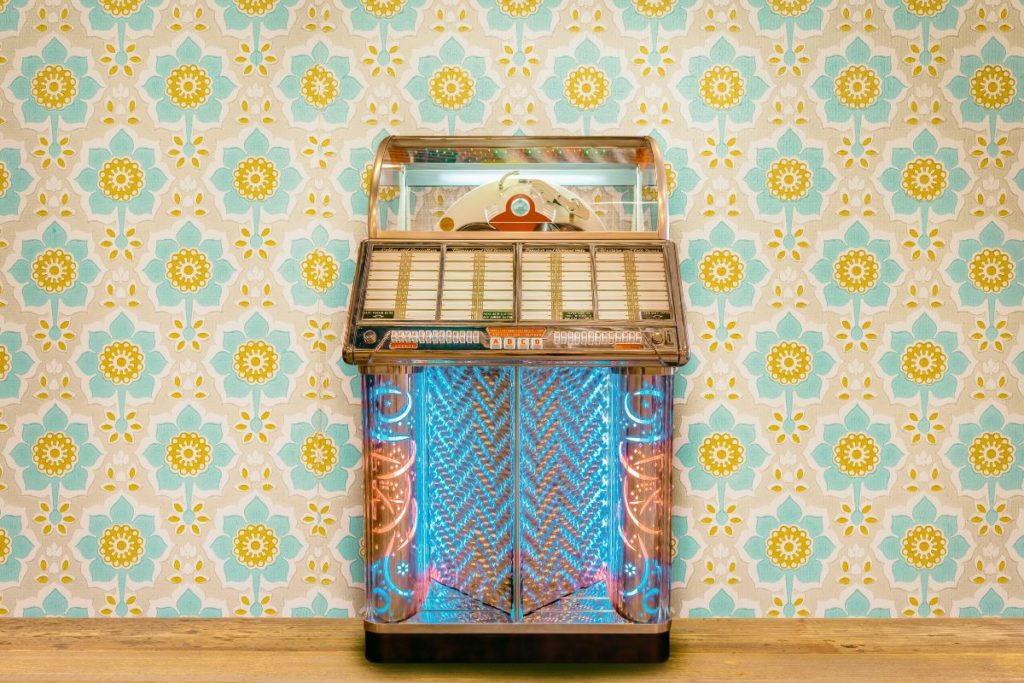 Antique jukebox in front of wall