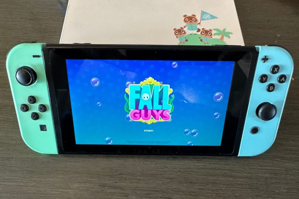 Nintendo Switch with Fall Guys On The Screen